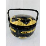 Black lacquered and gilt decorated marriage pot.