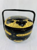 Black lacquered and gilt decorated marriage pot.