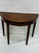 Mahogany demi-lune table.