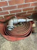 Reel of fire hose by George Angus & Co Ltd with aluminium nozzle.