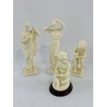 Four Greek parian china figurines.