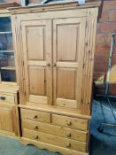 Pine double wardrobe above 3 drawers.