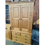 Pine double wardrobe above 3 drawers.