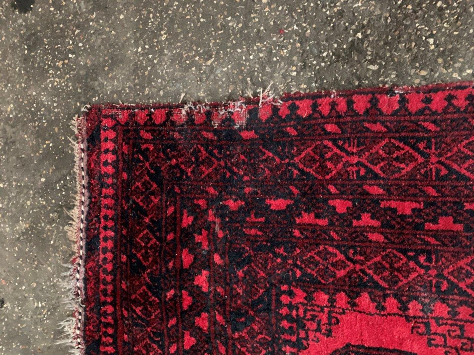 Wool pile red ground Afghan carpet. - Image 3 of 5