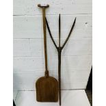 A wooden malt shovel, a hay fork, and a yolk.