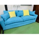Three seat sofa by "Sofa Workshop" upholstered in turquoise cotton loose covers, with matching cushi