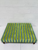 Large foot stool upholstered in turquoise and green stripes