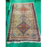 Hand-knotted brown ground Middle Eastern rug, 200 x 118cms.
