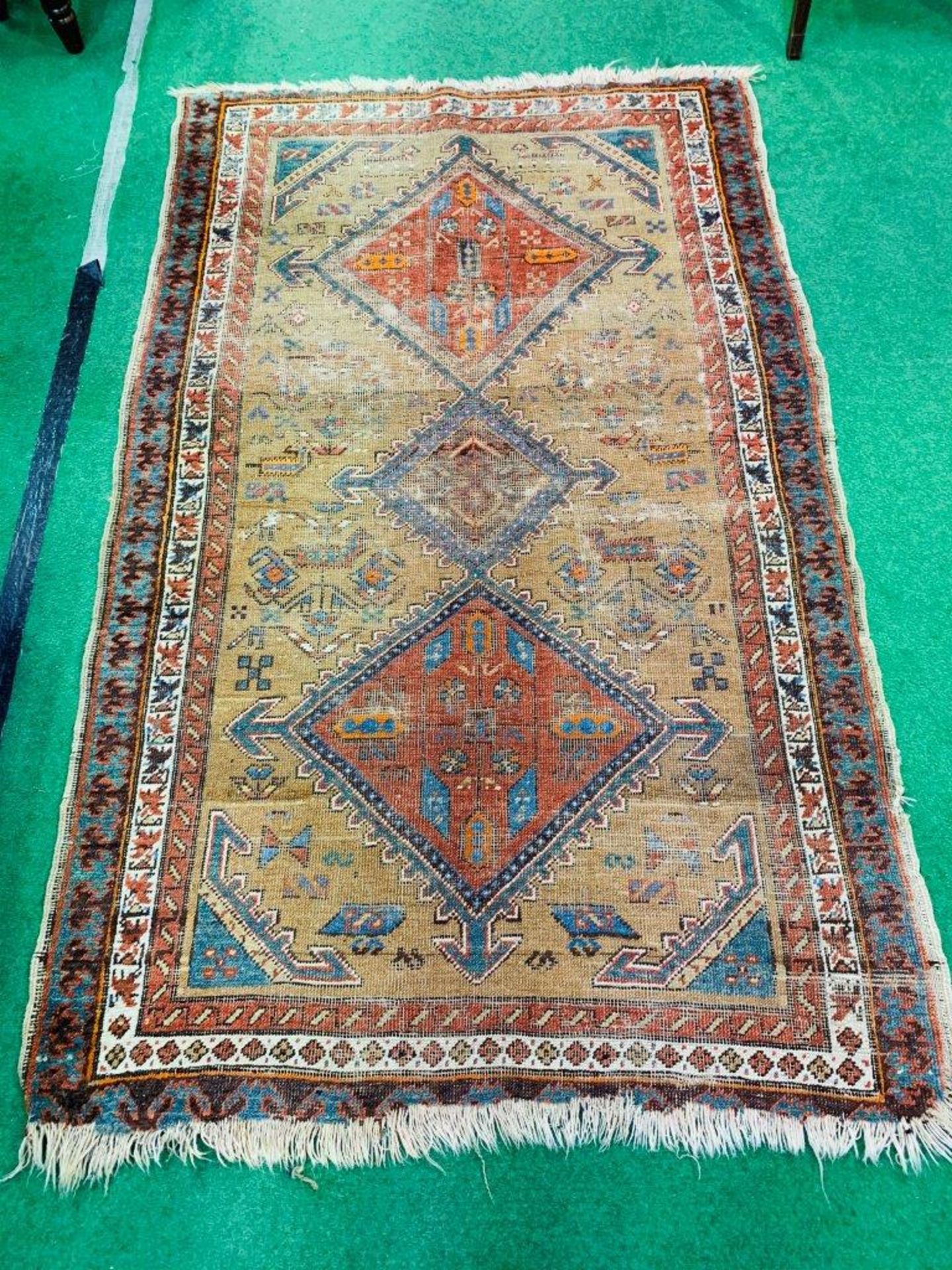 Hand-knotted brown ground Middle Eastern rug, 200 x 118cms.