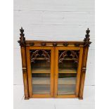 Victorian Gothic oak bookcase with glazed doors.
