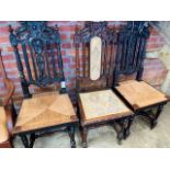 5 oak framed hall chairs with carved top and centre splat.