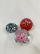 Group of 3 signed glass paperweights, two Caithness and one