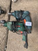 Bosch PSB650RE drill and a Black and Decker KD562 drill.
