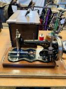 Junker and Ruh Sewing machine in wooden case.