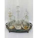 Silver plated gallery tray with inscription, together with five glass decanters and a Stuart Crystal