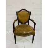 Mahogany framed olive leather upholstered shield-back open arm chair.