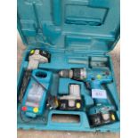 Makita cordless drill with 3 batteries and a charger in a case.