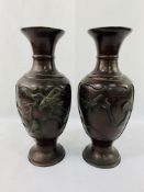 Pair of Meiji period bronze vases with etched and applied decoration to panels on both sides