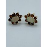 Opal and Garnet 9ct gold cluster set stud earrings.