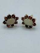 Opal and Garnet 9ct gold cluster set stud earrings.