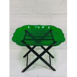 Lucite bottle green tray with scalloped edges, on collapsable stand.