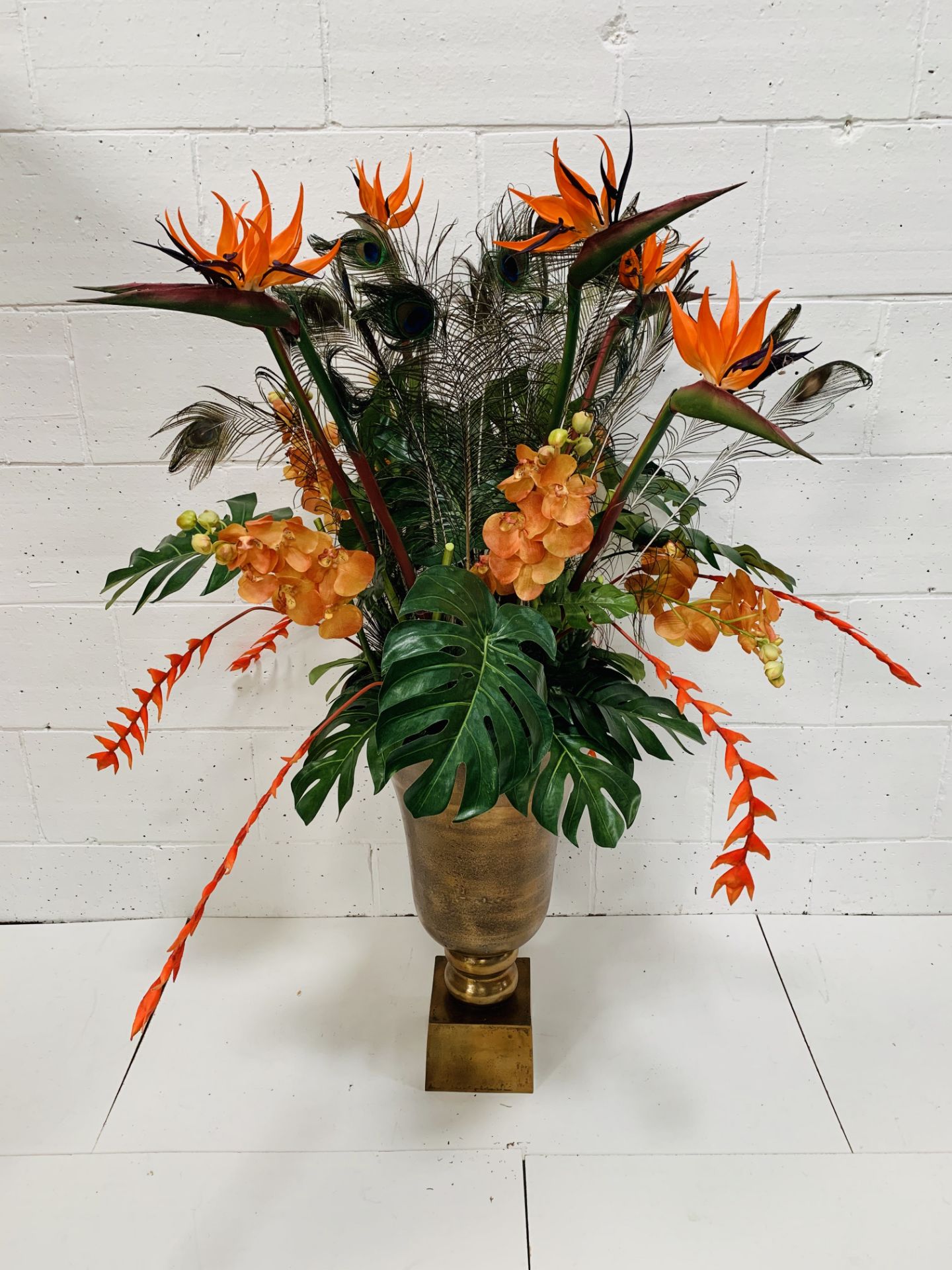 Large ceramic vase on stand, with artificial flower display