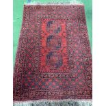Kayam wool pile red ground carpet rug made in Afghanistan, Afghan Nhzat, 140 x 99cms.
