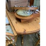 Circular drop-leaf pine kitchen table; 4 Windsor chairs; a circular utensil hanger and a pine cased