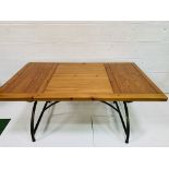 Hardwood table on metal X frame legs with stretcher, together with six matching chairs.