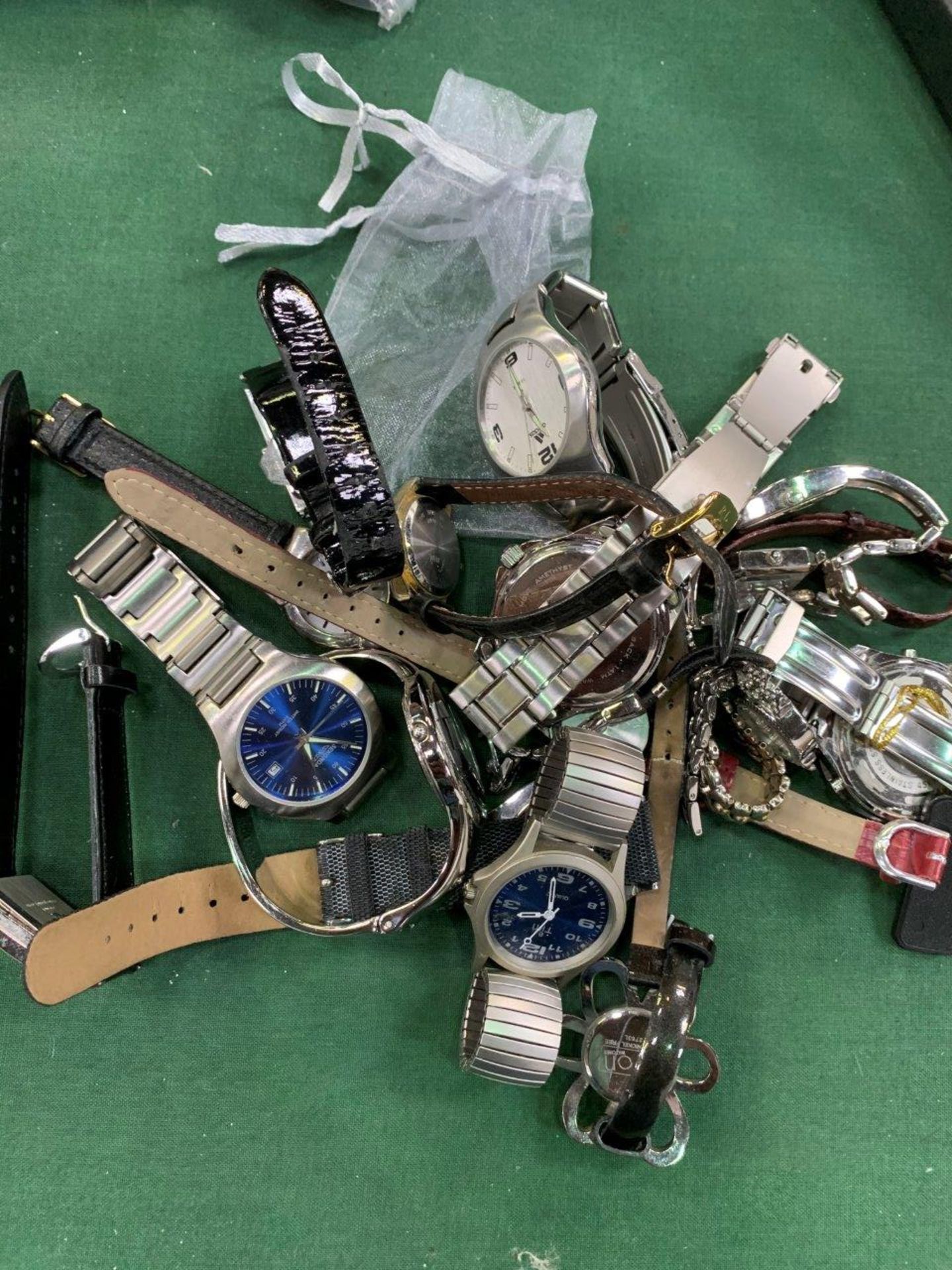 A bag of 18 assorted fashion watches.