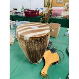 Cowhide bongo drum, set of bellows and a brass lamp on a marble base as found.