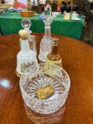 Two glass decanters; a Bell's Whisky decanter; a Bell's Whisky porcelain decanter; a glass bowl