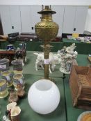 Brass table lamp complete with glass shade.