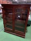 Mahogany glazed bookcase with three shelves, over two drawers