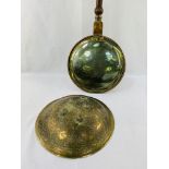 Brass bowl-shaped ornament together with a brass and copper long handled bed warming pan.