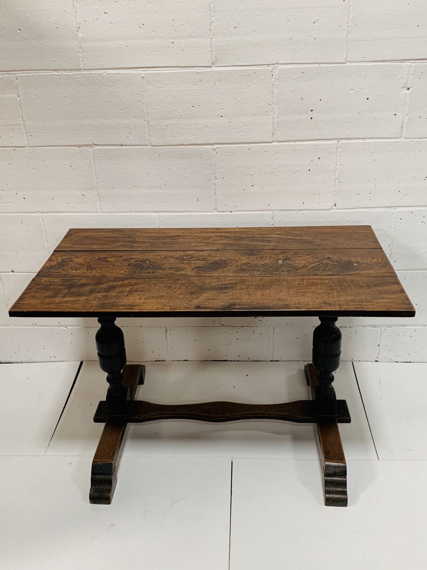 Oak table on bulbous supports with stretcher.