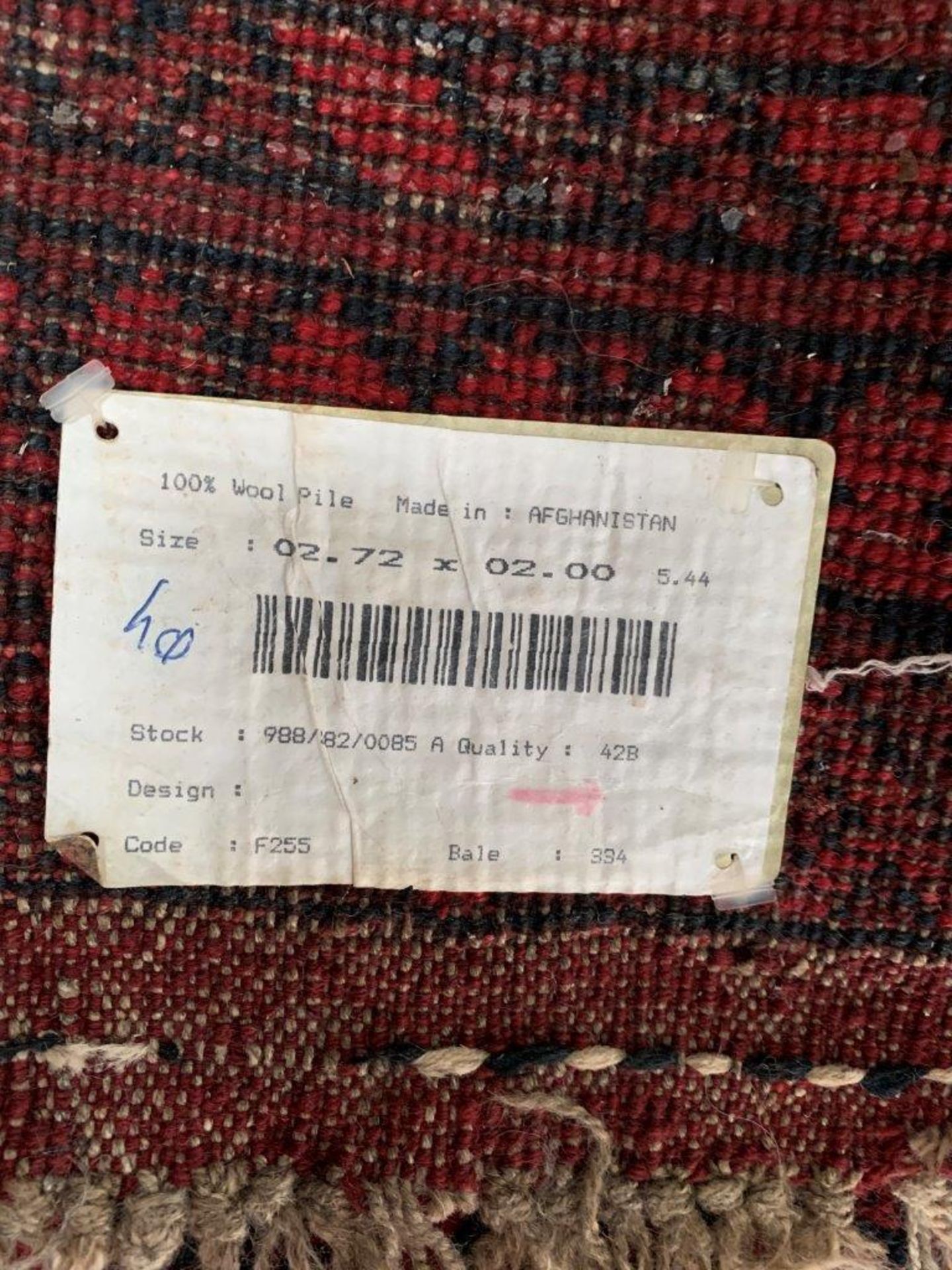 Wool pile red ground Afghan carpet. - Image 5 of 5