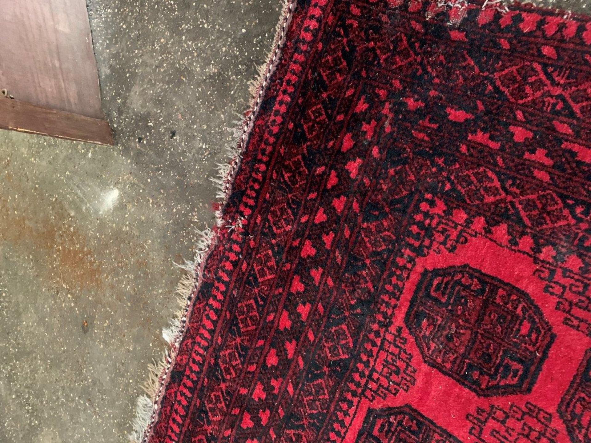Wool pile red ground Afghan carpet. - Image 4 of 5