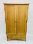 Oak double wardrobe with drawer beneath, 100 x 62 x 190cms.