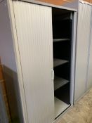 Two metal tambour-fronted cabinets, with interior shelves.