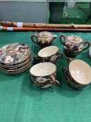 Early 20th century Chinese hand painted, black and gold dragon design tea set.