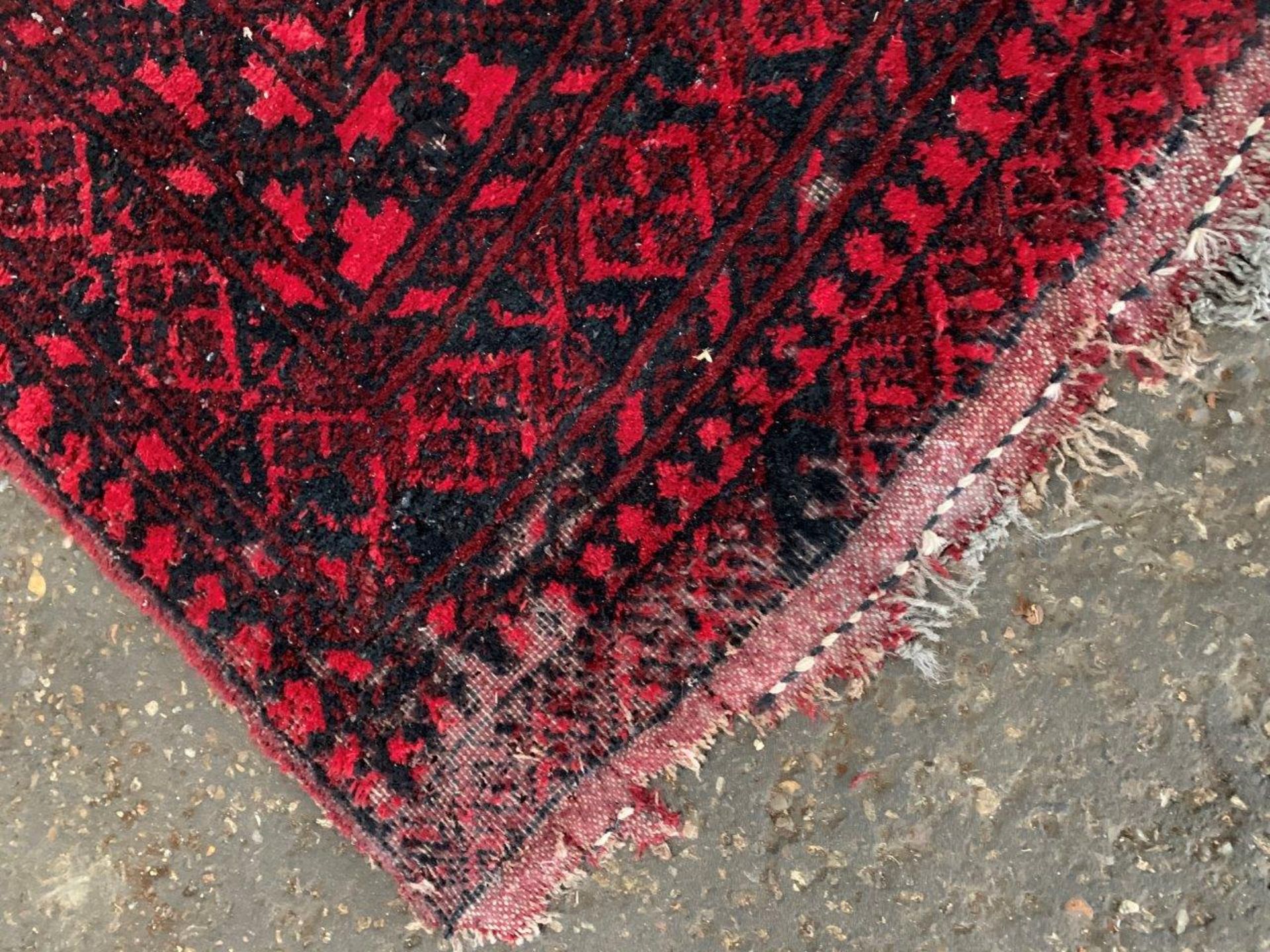 Wool pile red ground Afghan carpet. - Image 2 of 5