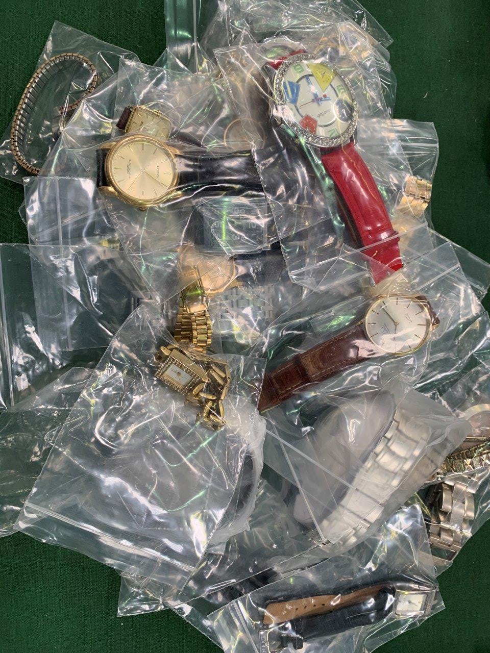 A bag of 25 assorted fashion watches.