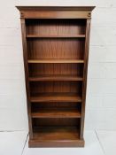 Mahogany open book case of five shelves.