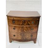 Mahogany bow-fronted chest with three drawers and pull out slide.