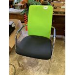 2 chrome framed green and black upholstered armchairs