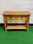 Pine side table with two frieze drawers and display shelf beneath