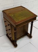 Early 20th century mahogany Davenport with tooled leather slope and side drawers.