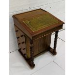 Early 20th century mahogany Davenport with tooled leather slope and side drawers.