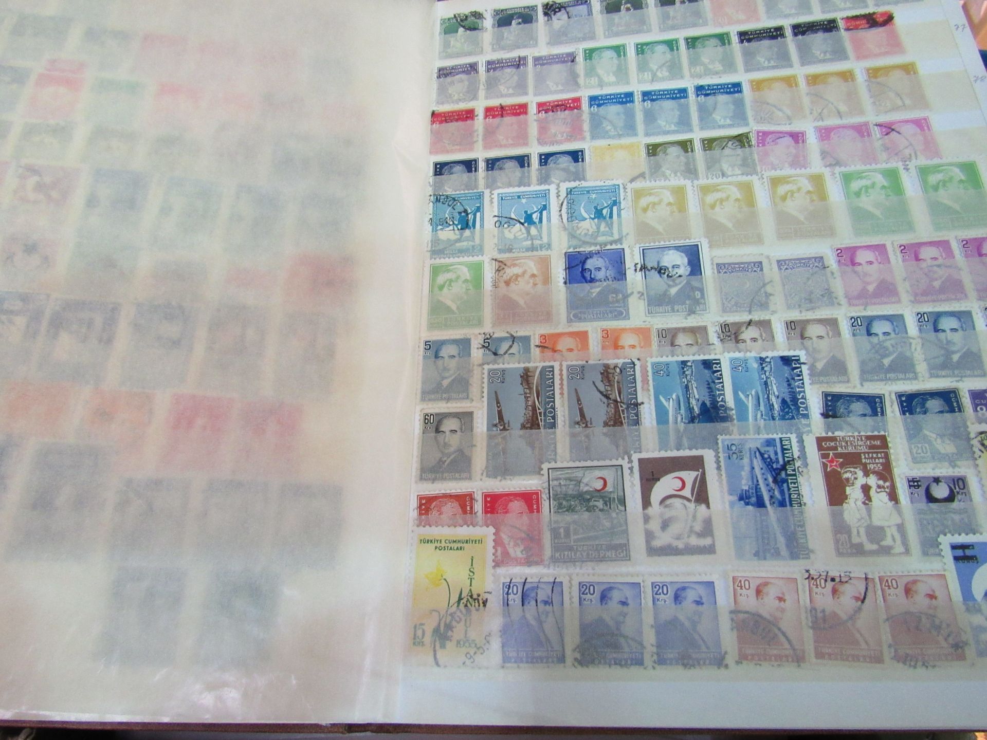 World stamps on pages and 2 stock books, 1000's of stamps.